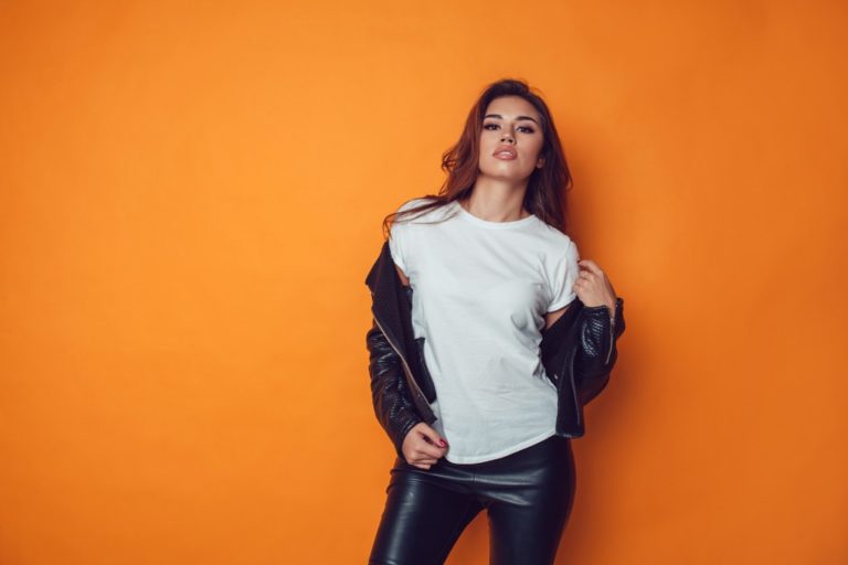 woman with leather jacket and pants posing